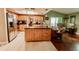 Well-appointed kitchen with stainless steel appliances, island, and open access to the living room at 4434 Dewey Dr, New Port Richey, FL 34652