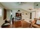 Spacious living area with hardwood floors, an open layout, and a view of the kitchen at 4434 Dewey Dr, New Port Richey, FL 34652