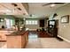 Large kitchen and living area with seamless flooring, stainless appliances, and ample lighting at 4434 Dewey Dr, New Port Richey, FL 34652
