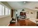 Inviting living room with wood floors, plantation shutters, vaulted ceiling, and modern decor at 4434 Dewey Dr, New Port Richey, FL 34652