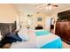 Well-lit main bedroom featuring ceiling fan and carpeted flooring at 4434 Dewey Dr, New Port Richey, FL 34652