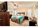 Main bedroom with neutral walls, ceiling fan, and carpeted floors at 4434 Dewey Dr, New Port Richey, FL 34652