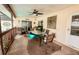 Covered patio with dining table and chairs is perfect for al fresco dining at 4434 Dewey Dr, New Port Richey, FL 34652