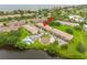 Scenic aerial view of waterfront condos, showcasing the community pool and convenient parking at 4510 Overlook Ne Dr # 224, St Petersburg, FL 33703
