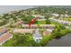 Aerial view of the building's complex, with swimming pool and surrounding landscaping near the water at 4510 Overlook Ne Dr # 224, St Petersburg, FL 33703