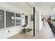 Property front door and facade with porch and black supporting columns at 4510 Overlook Ne Dr # 224, St Petersburg, FL 33703