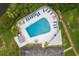 Aerial shot of community pool with lounge chairs and meticulous landscaping at 4510 Overlook Ne Dr # 224, St Petersburg, FL 33703