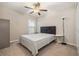 Inviting bedroom with carpet, a ceiling fan, closet and a window for natural lighting, creating a relaxing atmosphere at 4726 Wild Senna Blvd, Tampa, FL 33619