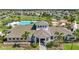 A beautiful clubhouse, pool and playground with surrounding houses and landscape at 4726 Wild Senna Blvd, Tampa, FL 33619
