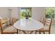 Inviting dining area featuring a neutral color scheme and a view to the backyard at 4726 Wild Senna Blvd, Tampa, FL 33619