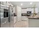 Modern kitchen featuring stainless steel appliances, white cabinets, and a functional layout perfect for cooking at 4726 Wild Senna Blvd, Tampa, FL 33619