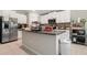 Kitchen with stainless steel appliances, granite countertops, and bright white cabinetry providing ample storage at 4726 Wild Senna Blvd, Tampa, FL 33619