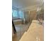 Bathroom with a walk-in shower, a soaking tub, dual vanities, and neutral tones at 4745 Trout River Xing, Ellenton, FL 34222