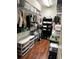 Walk-in closet with laminate wood flooring and shelving to maximize storage space at 4745 Trout River Xing, Ellenton, FL 34222