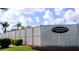 A sign reads Covered Bridge Estates by the community fencing and manicured landscaping at 4745 Trout River Xing, Ellenton, FL 34222