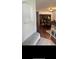 Open floor plan with bench near archway looking into the dining area with table and chairs at 4745 Trout River Xing, Ellenton, FL 34222