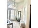 Bright foyer with tile flooring, arched windows, and elegant decor, offering a welcoming entrance at 4745 Trout River Xing, Ellenton, FL 34222