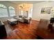 Spacious living room featuring hardwood floors, high ceilings, and large windows, filled with natural light at 4745 Trout River Xing, Ellenton, FL 34222
