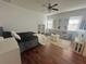 A spacious main bedroom features a ceiling fan, decorative shelving, and natural light at 4745 Trout River Xing, Ellenton, FL 34222