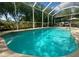 Inviting screened-in pool with clear blue water and lounge chairs, perfect for relaxation and outdoor enjoyment at 4745 Trout River Xing, Ellenton, FL 34222