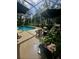 Screened-in pool with patio furniture creating a serene and outdoor living space at 4745 Trout River Xing, Ellenton, FL 34222