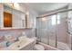 This cozy bathroom features a shower with glass doors, toilet, and sink at 4911 Bartelt Rd, Holiday, FL 34690
