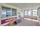 Enclosed sunroom with multiple windows providing natural light and offering a versatile living space at 4911 Bartelt Rd, Holiday, FL 34690