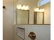 Elegant bathroom featuring double mirrors, gold fixtures and neutral tile surround at 5033 Chapel Row Ave, Apollo Beach, FL 33572
