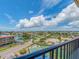 An aerial view of a waterfront community showing a blue tennis court with waterfront homes at 51 Island Way # 800, Clearwater Beach, FL 33767