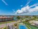 Beautiful aerial view of neighborhood, community tennis courts, and waterfront living at 51 Island Way # 800, Clearwater Beach, FL 33767