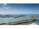 Expansive aerial view of a coastal community with waterfront homes, marinas, and stunning ocean views on a clear, sunny day at 51 Island Way # 800, Clearwater Beach, FL 33767