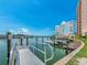 Community dock featuring boat slips and a tranquil waterfront setting at 51 Island Way # 800, Clearwater Beach, FL 33767