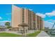 A waterfront condo complex with a pool, dock, and tiki huts, offering a resort-style living experience at 51 Island Way # 800, Clearwater Beach, FL 33767
