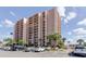 A well-maintained condominium exterior with balconies and lush tropical landscaping, providing a serene residential setting at 51 Island Way # 800, Clearwater Beach, FL 33767