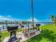 Community outdoor grilling area features picnic tables and water access for convenient barbecues at 51 Island Way # 800, Clearwater Beach, FL 33767