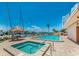 Community pool and hot tub with clear blue water and marina view at 51 Island Way # 800, Clearwater Beach, FL 33767
