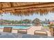 An inviting waterfront pool area with tiki bar and covered seating, perfect for outdoor entertaining and enjoying the views at 51 Island Way # 800, Clearwater Beach, FL 33767