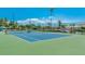 Well-maintained tennis court with a green and blue surface, perfect for residents to enjoy a game with waterfront scenery at 51 Island Way # 800, Clearwater Beach, FL 33767