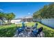 Backyard with fire pit and view of screened pool at 5102 Pheasant Woods Dr, Lutz, FL 33558