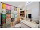 Colorful bathroom with a patterned shower curtain, granite countertop, and a decorative wall shelf at 5102 Pheasant Woods Dr, Lutz, FL 33558