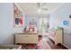 Bright bedroom with a vintage bed, wood floors, and a decorative tapestry, blending charm and style at 5102 Pheasant Woods Dr, Lutz, FL 33558