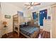 Cozy bedroom with a bunk bed, wood floors, and a baseball-themed decor providing a fun and functional space at 5102 Pheasant Woods Dr, Lutz, FL 33558
