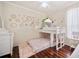 Charming bedroom with bunk beds, wood floors, and soft, neutral tones creating a cozy and inviting space at 5102 Pheasant Woods Dr, Lutz, FL 33558