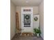 A charming front door adorned with a festive wreath and cute seasonal decor at 5102 Pheasant Woods Dr, Lutz, FL 33558