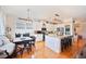 Bright kitchen and dining area featuring a large island and stainless appliances at 5102 Pheasant Woods Dr, Lutz, FL 33558