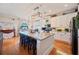 Kitchen with a large kitchen island with stone countertop and a breakfast bar at 5102 Pheasant Woods Dr, Lutz, FL 33558