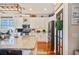 Bright kitchen featuring an island, white cabinets and stainless appliances at 5102 Pheasant Woods Dr, Lutz, FL 33558