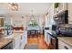 Bright kitchen featuring an island, stainless steel appliances, and a dining area at 5102 Pheasant Woods Dr, Lutz, FL 33558