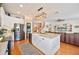Open kitchen with stainless steel appliances, granite counters, and island at 5102 Pheasant Woods Dr, Lutz, FL 33558