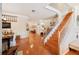 Spacious living room features wood floors, curved archways, and a staircase with white railings at 5102 Pheasant Woods Dr, Lutz, FL 33558
